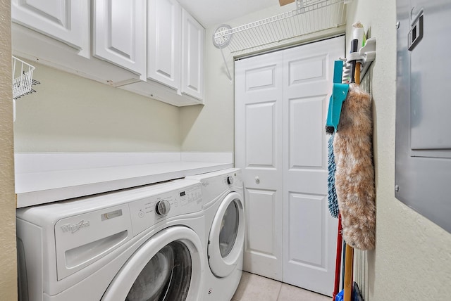 370 Golfview Rd Unit 304, North Palm Beach, FL 33408 - laundry room with cabinet space, washer and dryer, and light tile patterned flooring
