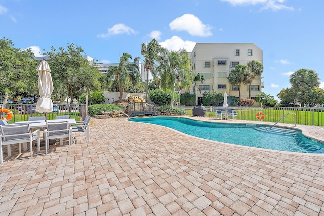 370 Golfview Rd Unit 304, North Palm Beach, FL 33408 - community pool featuring a patio area and outdoor dining area