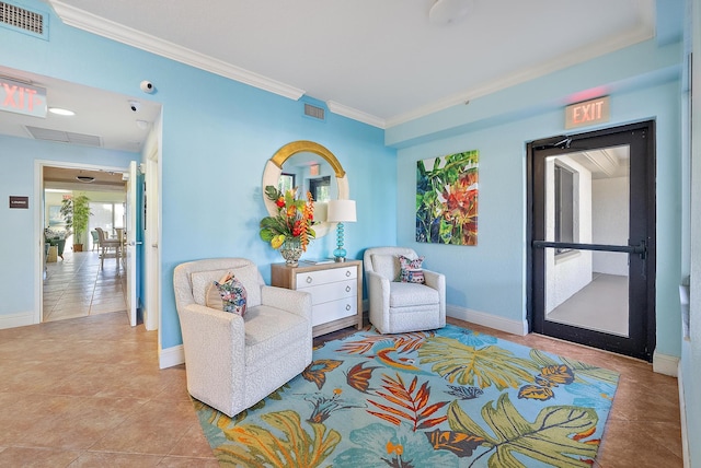 370 Golfview Rd Unit 304, North Palm Beach, FL 33408 - living area featuring tile patterned floors, crown molding, and baseboards