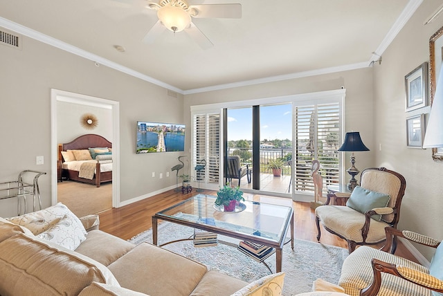 370 Golfview Rd Unit 304, North Palm Beach, FL 33408 - living room featuring ornamental molding, wood finished floors, baseboards, and ceiling fan