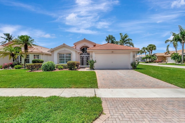 7714 Las Cruces Ct, Boynton Beach, FL 33437 - mediterranean / spanish house featuring stucco siding, decorative driveway, a garage, a tile roof, and a front yard
