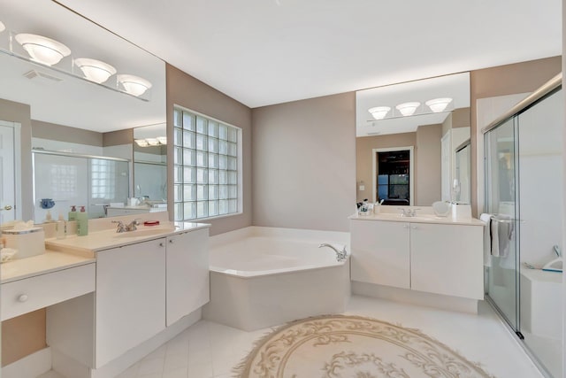 7714 Las Cruces Ct, Boynton Beach, FL 33437 - full bath featuring a shower stall, a garden tub, two vanities, and tile patterned floors