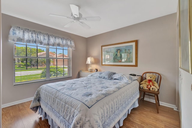 7714 Las Cruces Ct, Boynton Beach, FL 33437 - bedroom with baseboards, light wood-style floors, and a ceiling fan