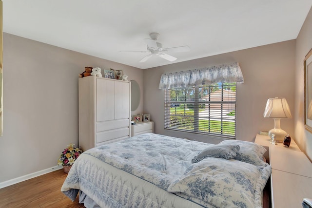 7714 Las Cruces Ct, Boynton Beach, FL 33437 - bedroom featuring baseboards, wood finished floors, and ceiling fan