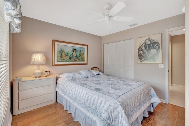 7714 Las Cruces Ct, Boynton Beach, FL 33437 - bedroom featuring a closet, light wood-type flooring, ceiling fan, and baseboards