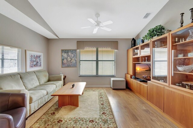 7714 Las Cruces Ct, Boynton Beach, FL 33437 - living room featuring healthy amount of natural light, light wood-style floors, a ceiling fan, and lofted ceiling