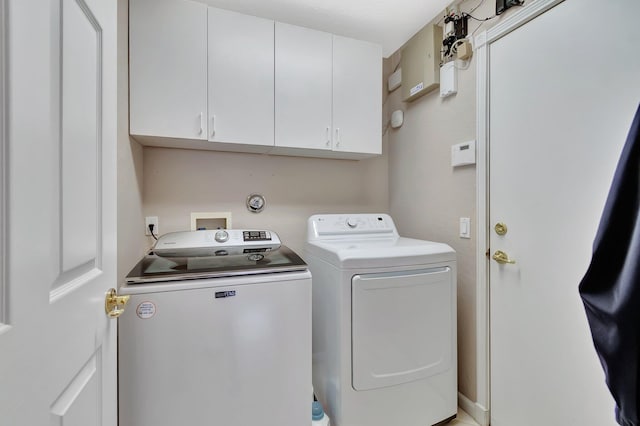 7714 Las Cruces Ct, Boynton Beach, FL 33437 - washroom featuring cabinet space and washer and clothes dryer