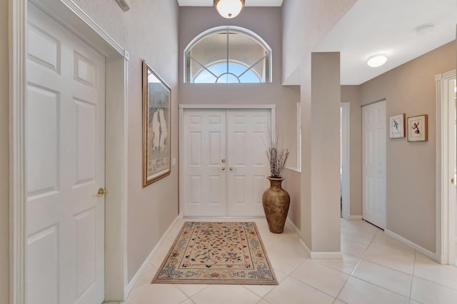 7714 Las Cruces Ct, Boynton Beach, FL 33437 - foyer featuring light tile patterned floors and baseboards