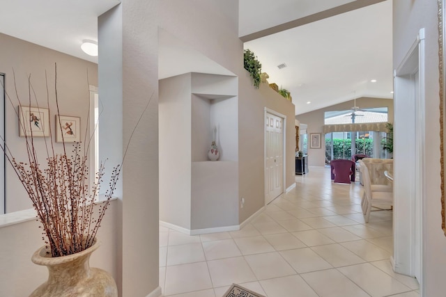 7714 Las Cruces Ct, Boynton Beach, FL 33437 - hall with lofted ceiling, tile patterned floors, and baseboards
