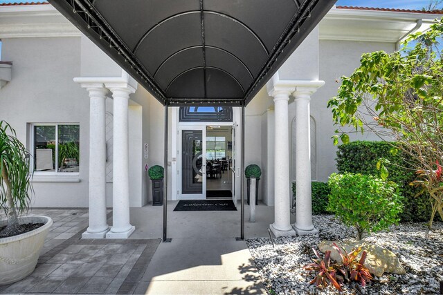 7714 Las Cruces Ct, Boynton Beach, FL 33437 - view of exterior entry with stucco siding