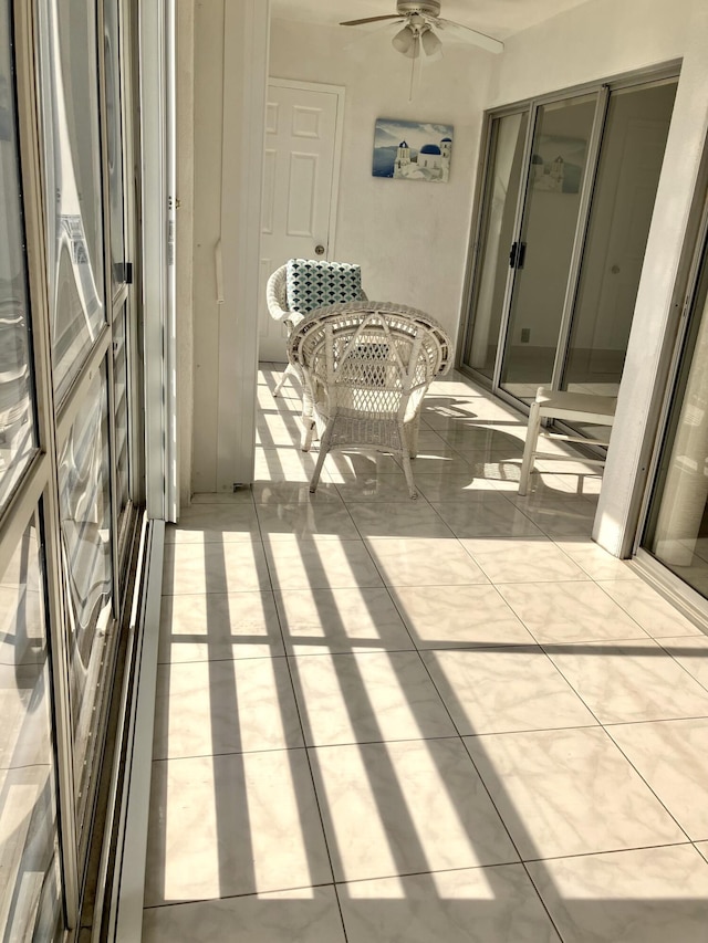 3590 Via Poinciana Unit 303, Lake Worth, FL 33467 - balcony featuring ceiling fan