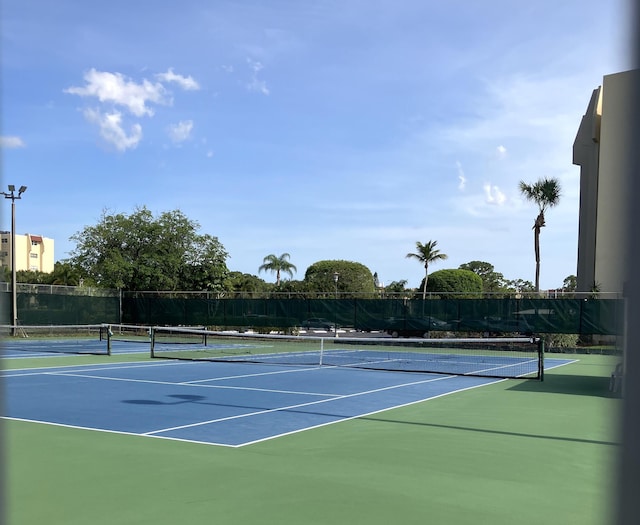 3590 Via Poinciana Unit 303, Lake Worth, FL 33467 - view of tennis court with community basketball court
