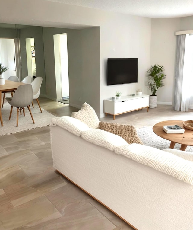 3590 Via Poinciana Unit 303, Lake Worth, FL 33467 - living area featuring baseboards
