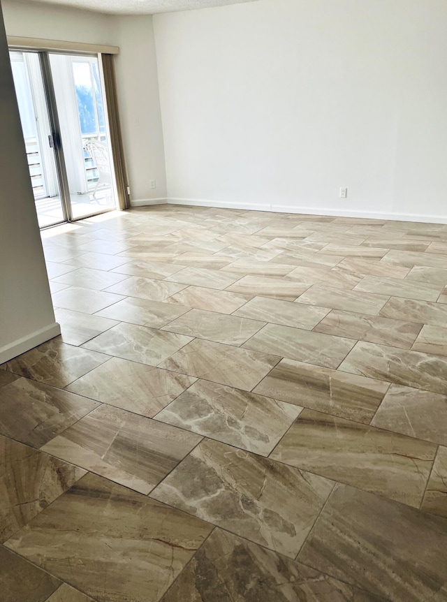 3590 Via Poinciana Unit 303, Lake Worth, FL 33467 - empty room with baseboards
