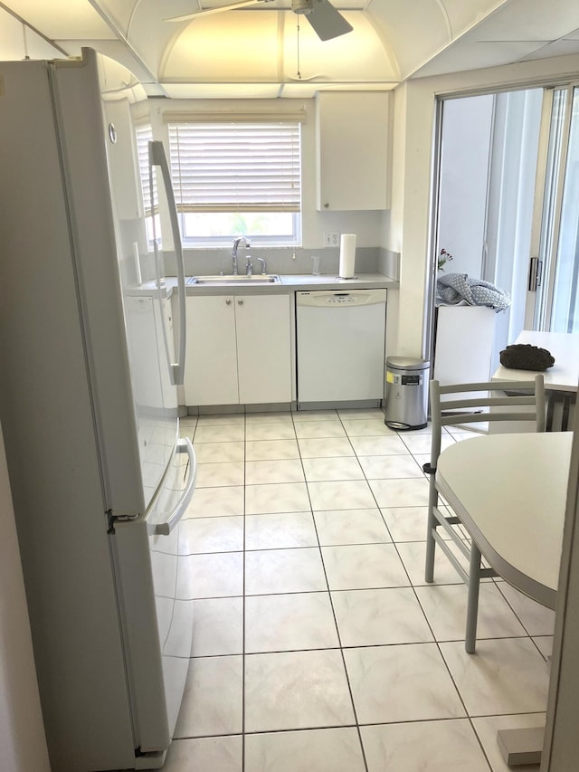 3590 Via Poinciana Unit 303, Lake Worth, FL 33467 - kitchen with white appliances, a sink, white cabinetry, light countertops, and ceiling fan