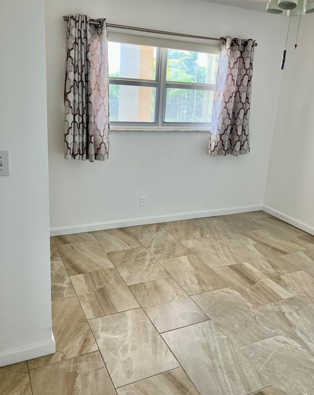 3590 Via Poinciana Unit 303, Lake Worth, FL 33467 - unfurnished room with baseboards