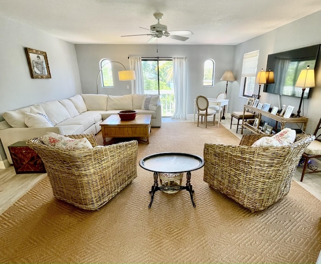 470 S Mars Way NE, Juno Beach, FL 33408 - carpeted living room with a ceiling fan and baseboards
