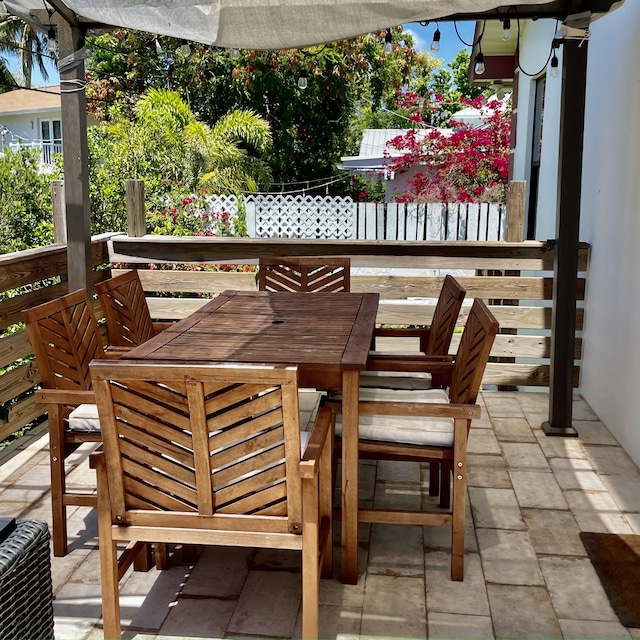 470 S Mars Way NE, Juno Beach, FL 33408 - view of patio featuring outdoor dining area