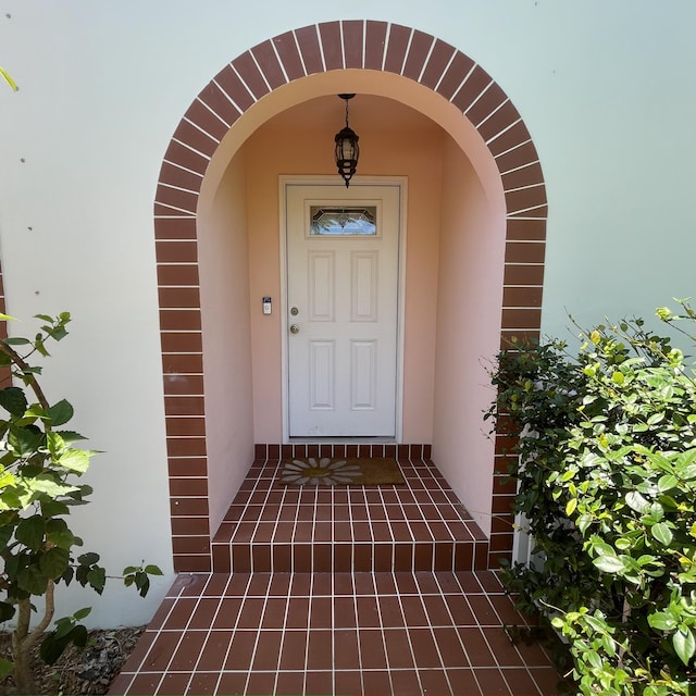 470 S Mars Way NE, Juno Beach, FL 33408 - property entrance with stucco siding