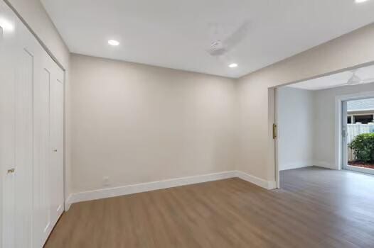 8914 Windtree St, Boca Raton, FL 33496 - empty room with wood finished floors, baseboards, and recessed lighting