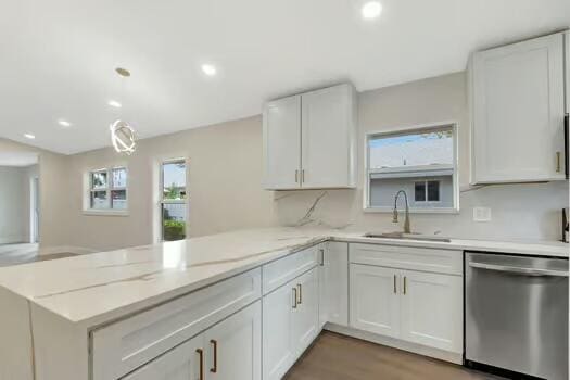 8914 Windtree St, Boca Raton, FL 33496 - kitchen featuring stainless steel dishwasher, a sink, a peninsula, healthy amount of natural light, and recessed lighting
