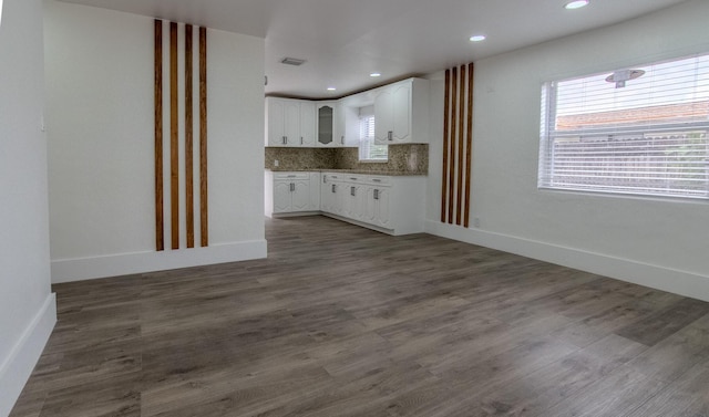 1510 S 23rd Ave, Hollywood, FL 33020 - kitchen with white cabinets, baseboards, dark wood-type flooring, backsplash, and recessed lighting