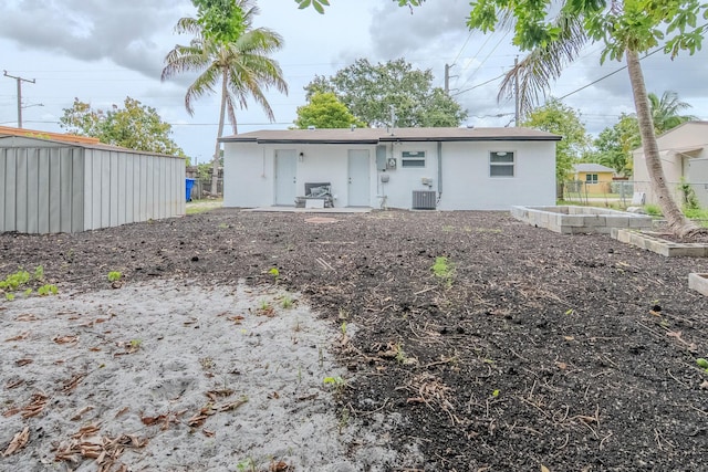 1510 S 23rd Ave, Hollywood, FL 33020 - rear view of property with cooling unit and stucco siding