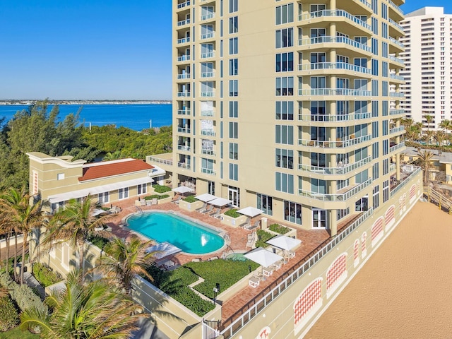 5050 N Ocean Dr Unit 701, Singer Island, FL 33404 - view of apartment building / complex featuring a community pool and a water view