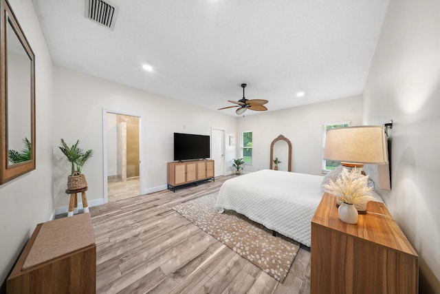 7903 Plantation Lakes Dr NW, Port Saint Lucie, FL 34986 - bedroom with wood finished floors, recessed lighting, baseboards, and ceiling fan
