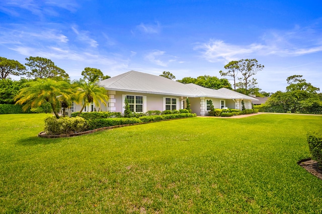 7903 Plantation Lakes Dr NW, Port Saint Lucie, FL 34986 - ranch-style house featuring a front lawn, metal roof, and stucco siding