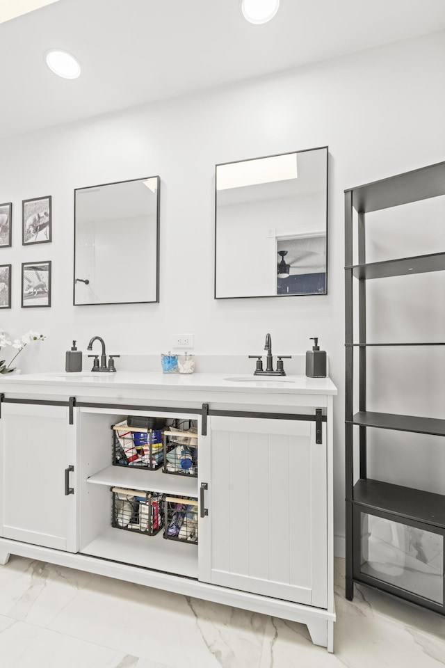9132 Sun Terrace Cir Unit D, Palm Beach Gardens, FL 33403 - bathroom with marble look tile flooring, double vanity, and recessed lighting