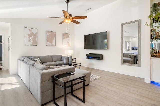 9132 Sun Terrace Cir Unit D, Palm Beach Gardens, FL 33403 - living area featuring lofted ceiling, ceiling fan, light wood-style floors, and baseboards