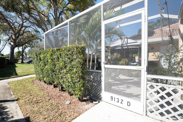 9132 Sun Terrace Cir Unit D, Palm Beach Gardens, FL 33403 - view of home's exterior featuring a lanai