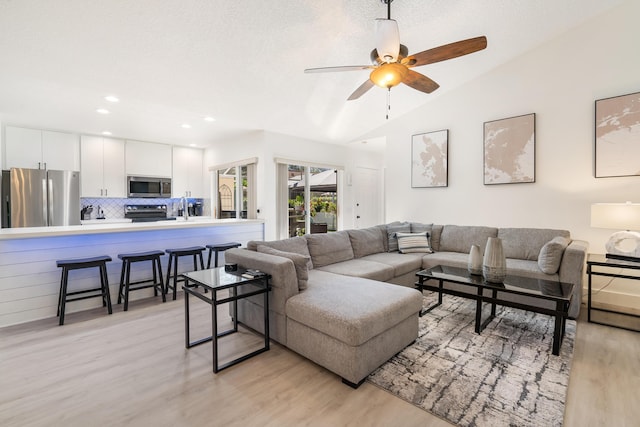 9132 Sun Terrace Cir Unit D, Palm Beach Gardens, FL 33403 - living room with light wood-style floors, vaulted ceiling, ceiling fan, and recessed lighting