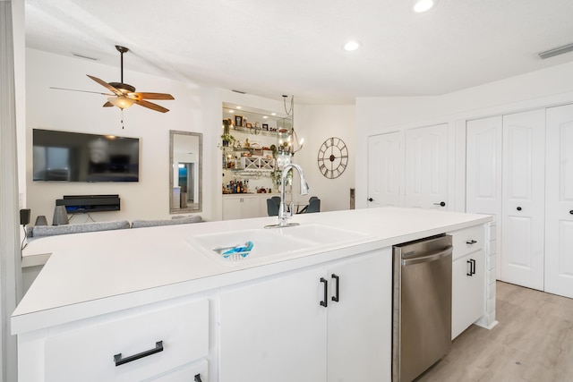 9132 Sun Terrace Cir Unit D, Palm Beach Gardens, FL 33403 - kitchen with a sink, dishwasher, open floor plan, white cabinetry, and light countertops
