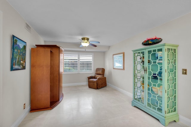 9628 Pavarotti Ter Unit 101, Boynton Beach, FL 33437 - living area with a ceiling fan, baseboards, and light tile patterned flooring