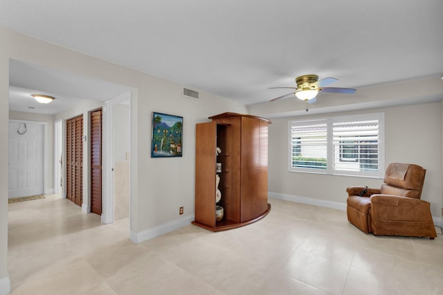 9628 Pavarotti Ter Unit 101, Boynton Beach, FL 33437 - living area with a ceiling fan and baseboards