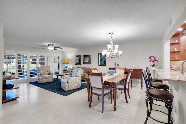 9628 Pavarotti Ter Unit 101, Boynton Beach, FL 33437 - dining space with ceiling fan, a chandelier, and a textured ceiling