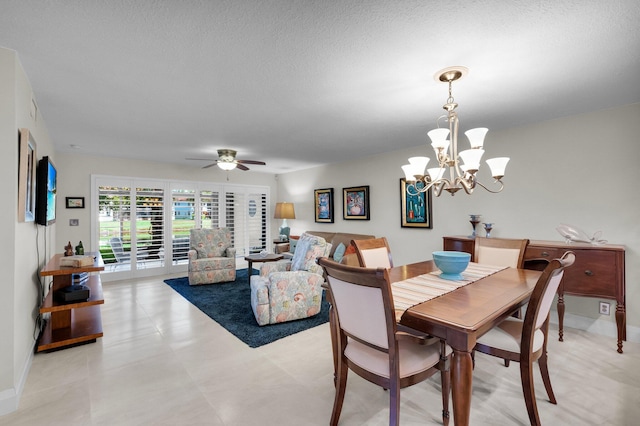 9628 Pavarotti Ter Unit 101, Boynton Beach, FL 33437 - dining area with a chandelier, baseboards, a ceiling fan, and a textured ceiling