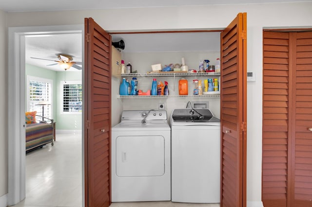 9628 Pavarotti Ter Unit 101, Boynton Beach, FL 33437 - laundry room with washing machine and dryer, a ceiling fan, light tile patterned floors, and baseboards