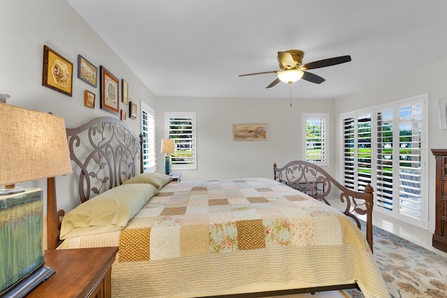 9628 Pavarotti Ter Unit 101, Boynton Beach, FL 33437 - bedroom with access to exterior and ceiling fan