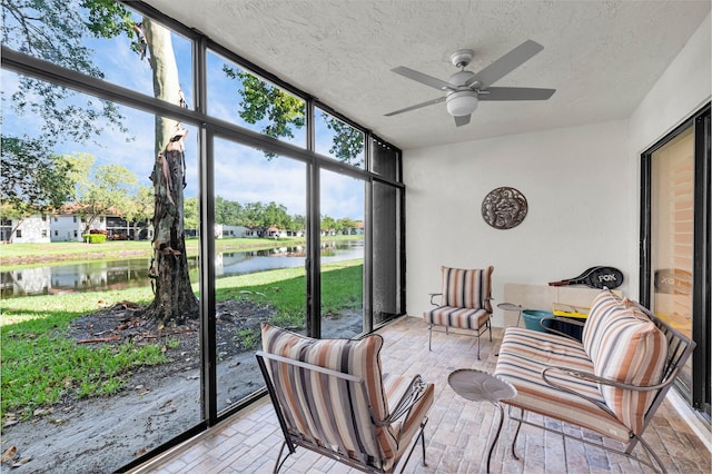 9628 Pavarotti Ter Unit 101, Boynton Beach, FL 33437 - sunroom featuring a ceiling fan and a water view