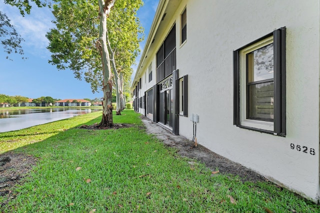 9628 Pavarotti Ter Unit 101, Boynton Beach, FL 33437 - view of grassy yard with a water view