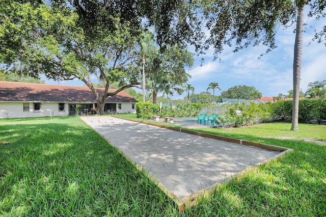 9628 Pavarotti Ter Unit 101, Boynton Beach, FL 33437 - surrounding community with a bocce ball area and a yard