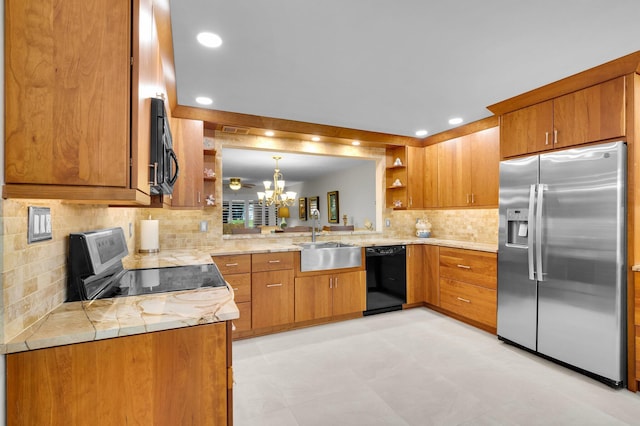 9628 Pavarotti Ter Unit 101, Boynton Beach, FL 33437 - kitchen featuring black appliances, a sink, open shelves, a chandelier, and brown cabinets