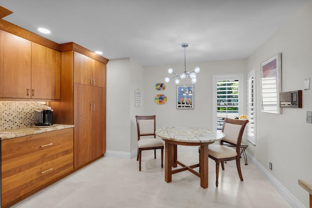 9628 Pavarotti Ter Unit 101, Boynton Beach, FL 33437 - dining room with a chandelier, baseboards, and recessed lighting