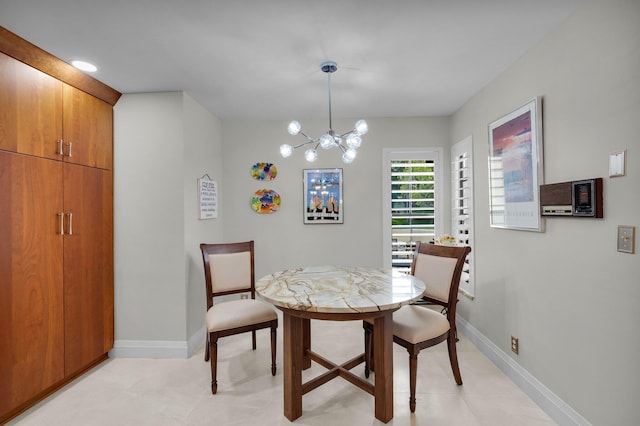 9628 Pavarotti Ter Unit 101, Boynton Beach, FL 33437 - dining room featuring baseboards and a chandelier