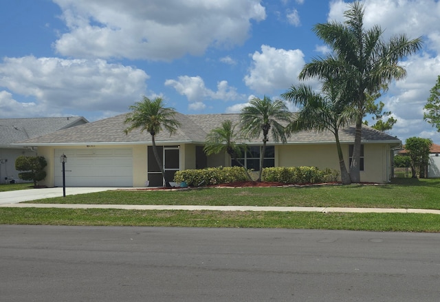 8205 Winnipesaukee Way, Lake Worth, FL 33467 - single story home featuring stucco siding, an attached garage, driveway, and a front lawn