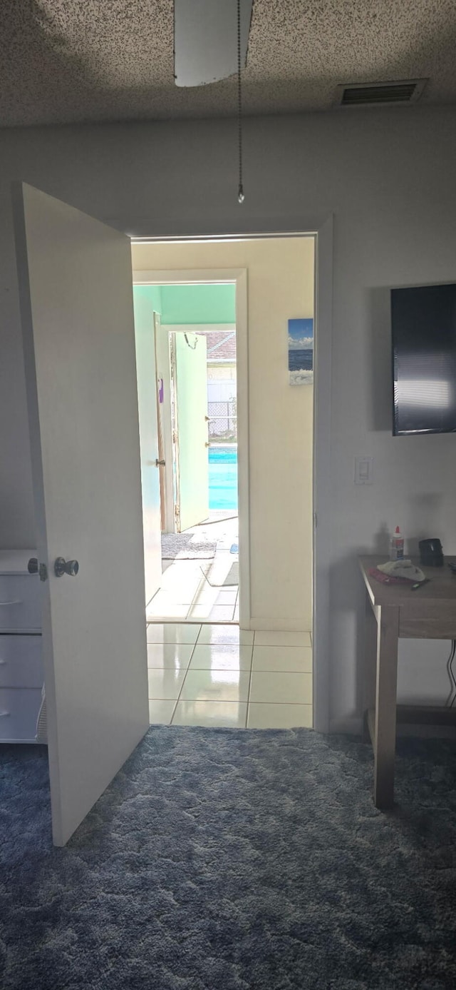 8205 Winnipesaukee Way, Lake Worth, FL 33467 - corridor featuring carpet and tile patterned floors