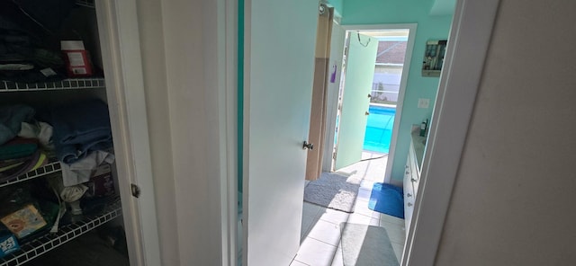 8205 Winnipesaukee Way, Lake Worth, FL 33467 - hall with healthy amount of natural light and light tile patterned flooring